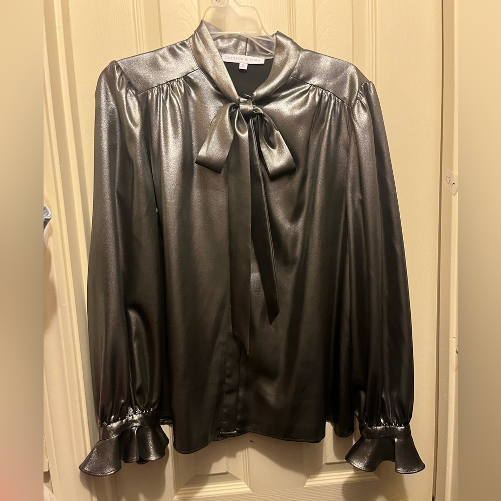 Silver long sleeve shirt with bow tie at neck